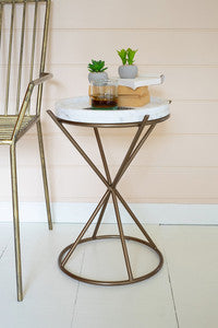 Iron hourglass side table with marble top