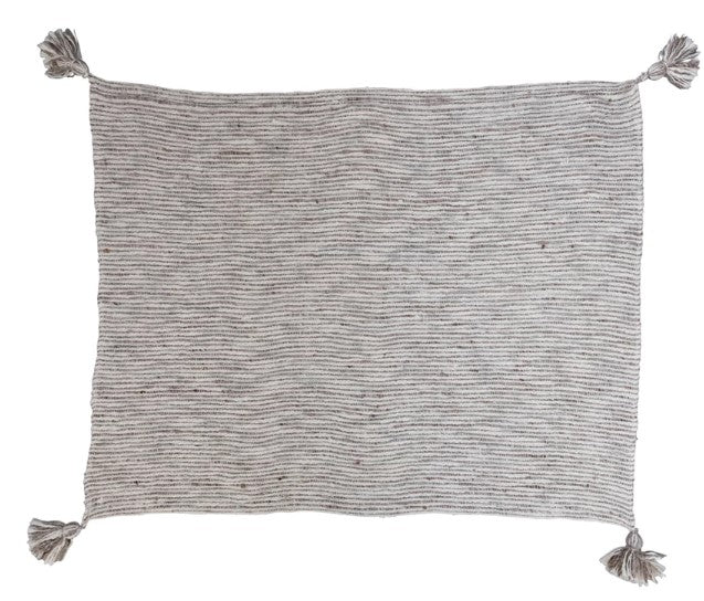 Textured throw with tassels